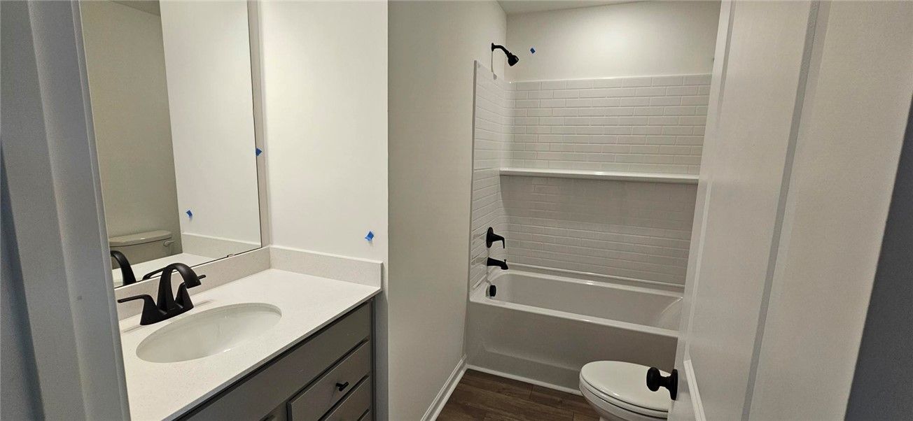 This newly updated bathroom features a sleek vanit
