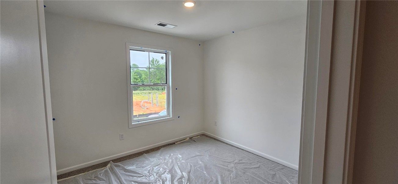 This bright room features a large window, offering