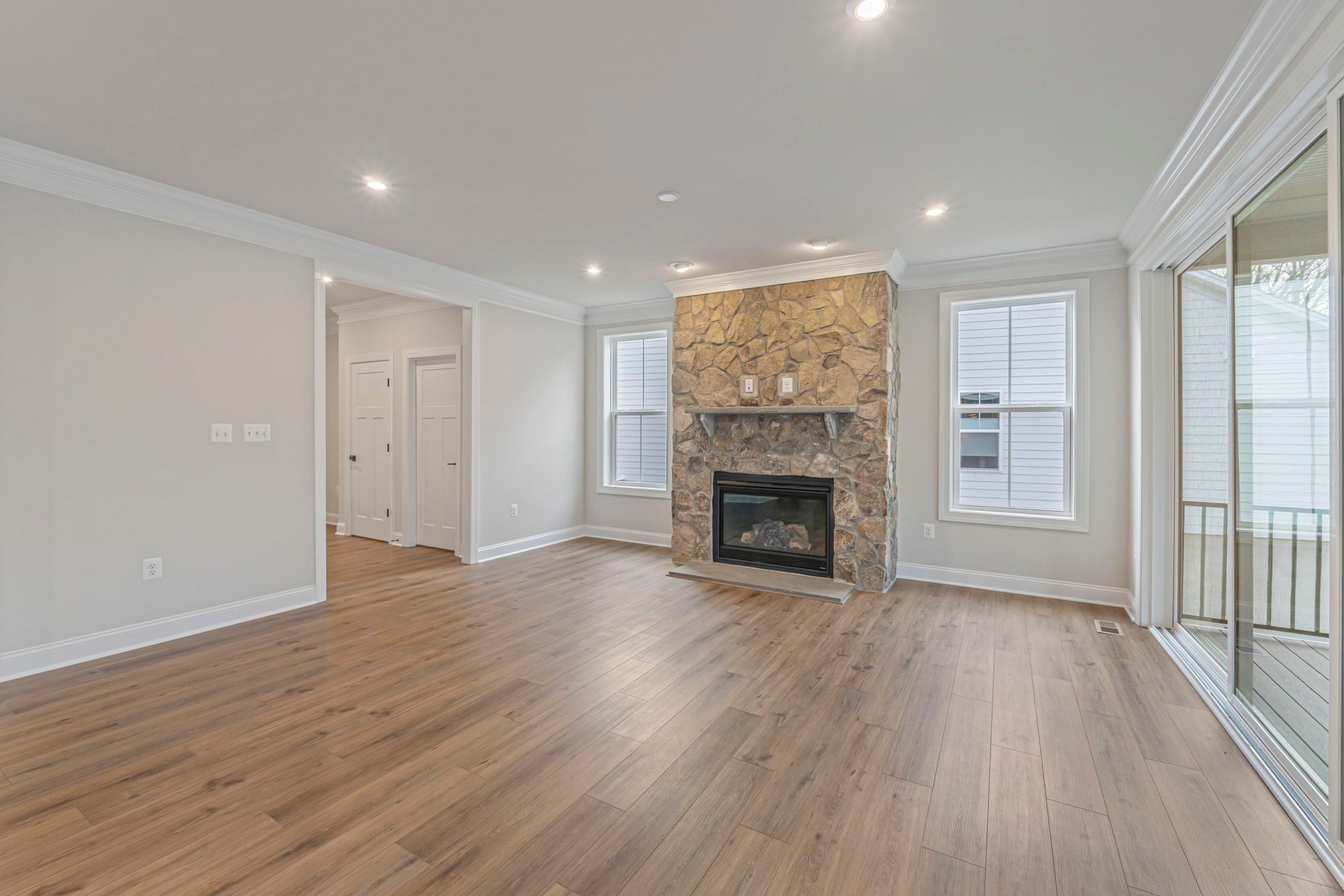 Family Room with Optional Stone Fireplace & Optional Sliding Doors