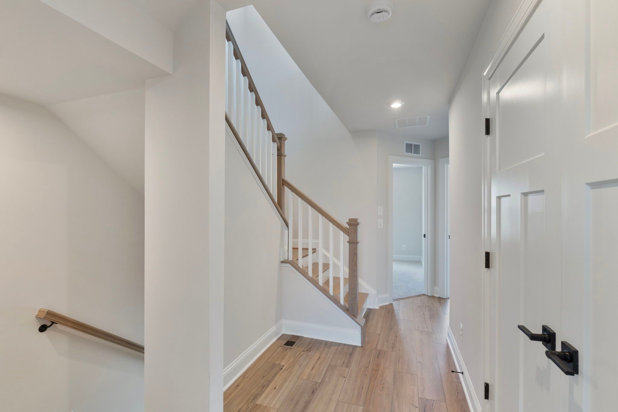 3rd level hall with stairs to optional 4th level - similar to photo