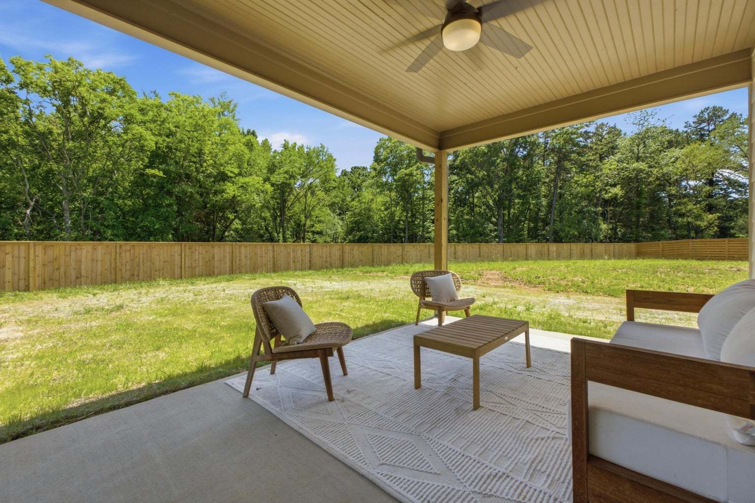 Spacious and flat backyard with a rear covered porch