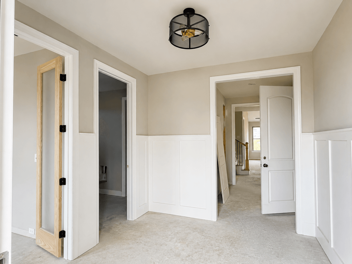 Wide foyer leads to the office, laundry and powder room