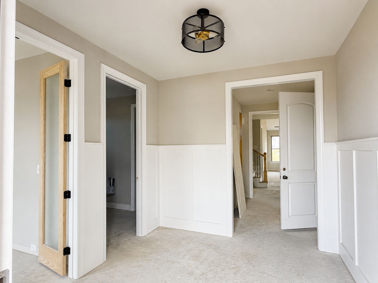 Wide foyer leads to the office, laundry and powder room