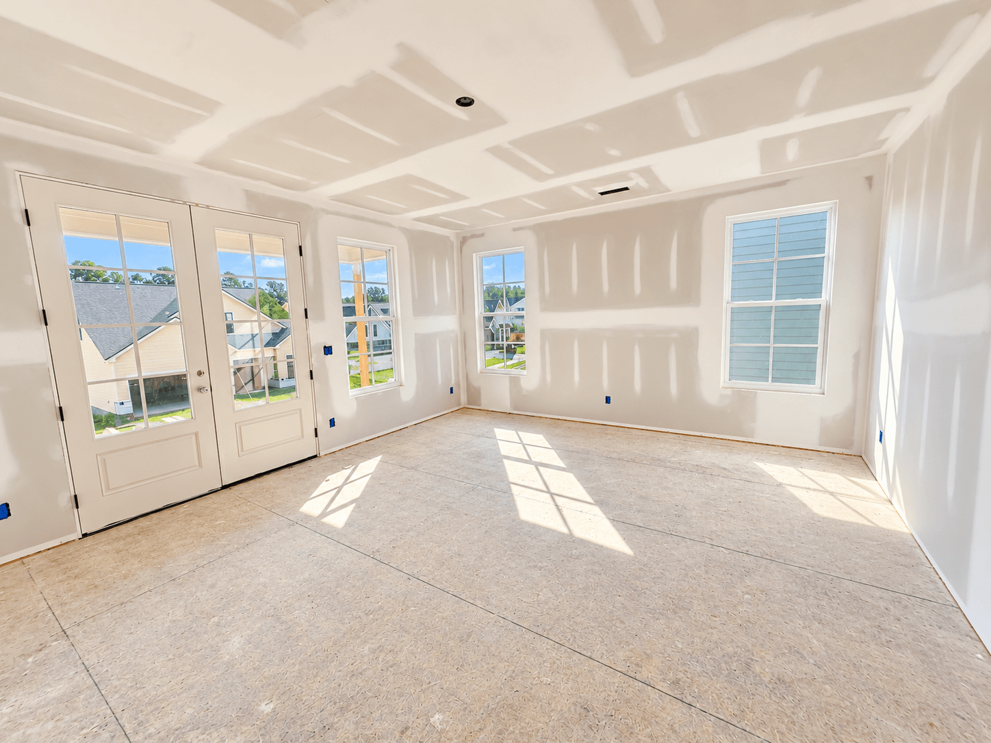 Double doors lead to upper covered porch