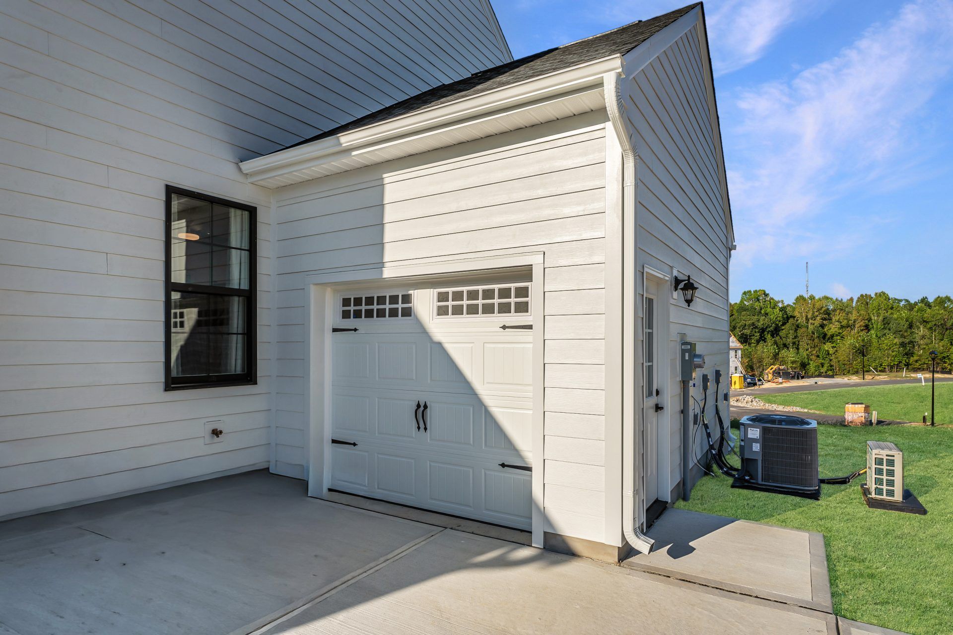 42 HHHunt Homes - Chatham- Thrid Car Garage with Pedestran Door