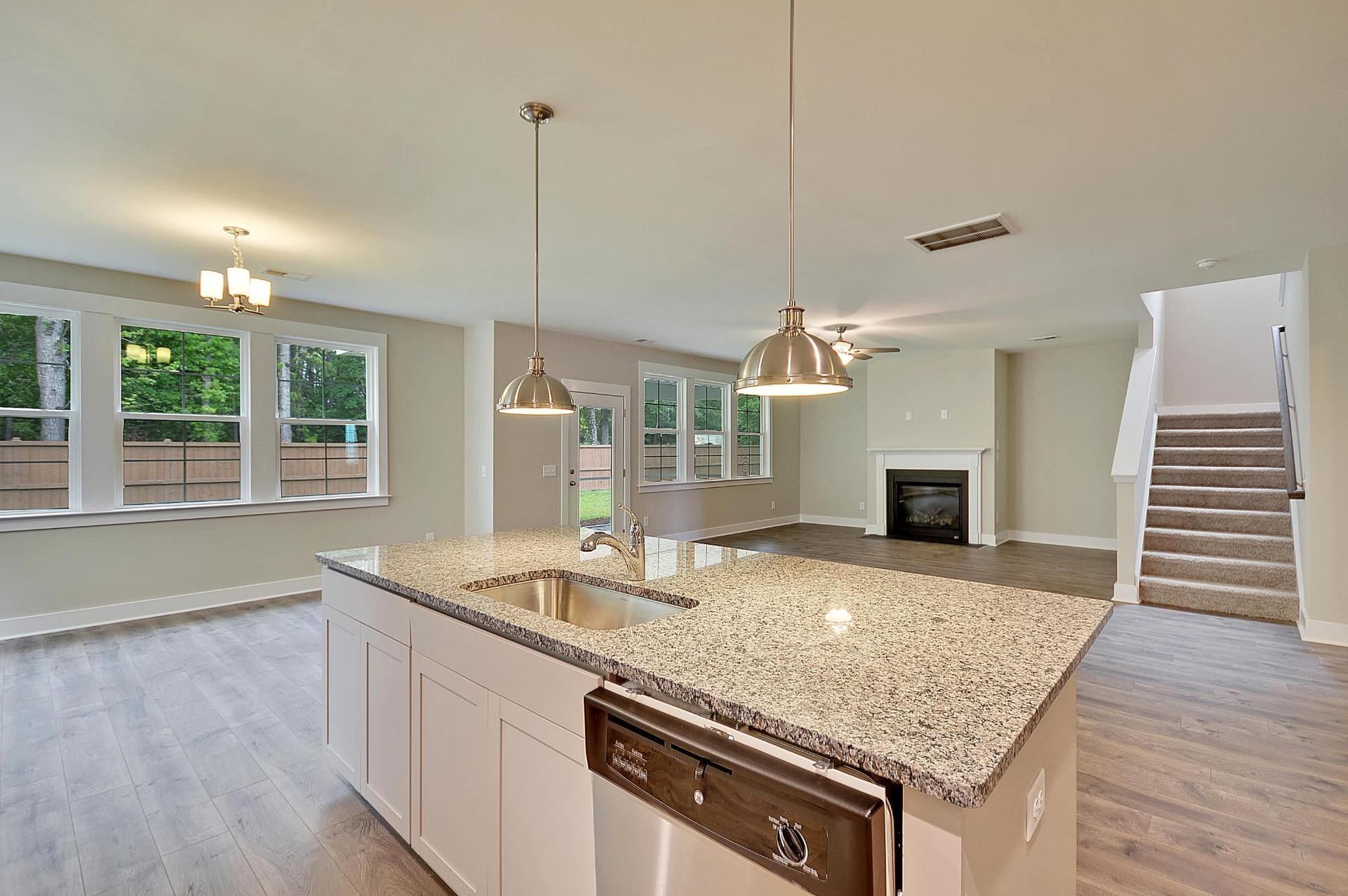 Maywood II Kitchen Island Overlooking Living Room