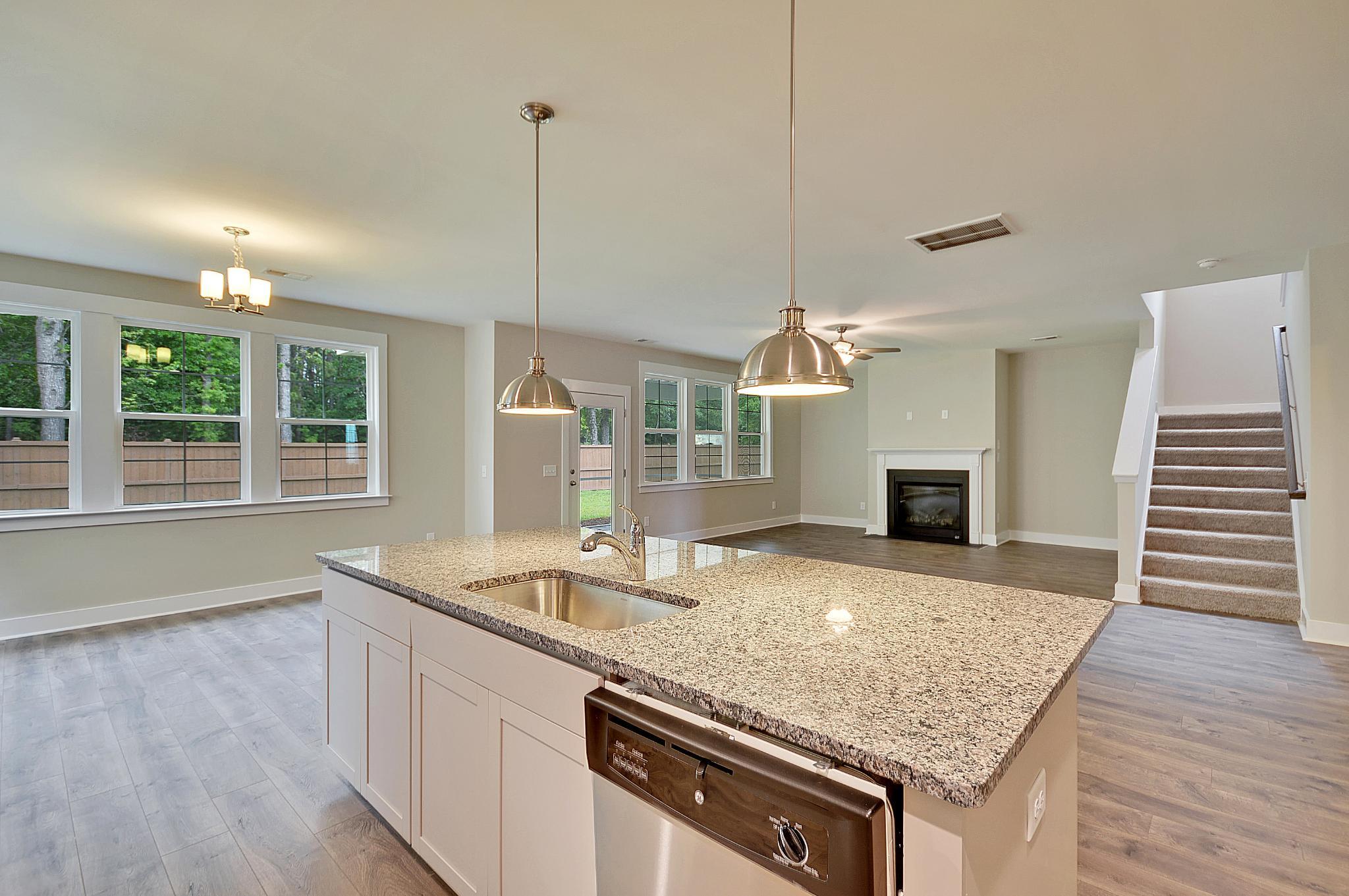 Maywood II Kitchen Island Overlooking Living Room
