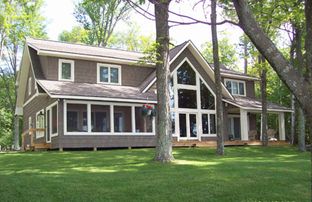 Indian River Custom Log Homes por Indian River Custom Log Homes en Traverse Michigan
