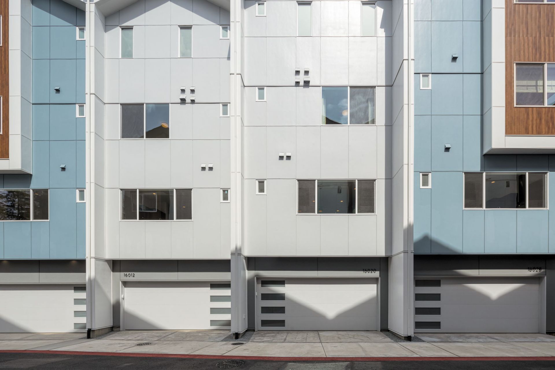 Garage entrances for the four homes in Building 1