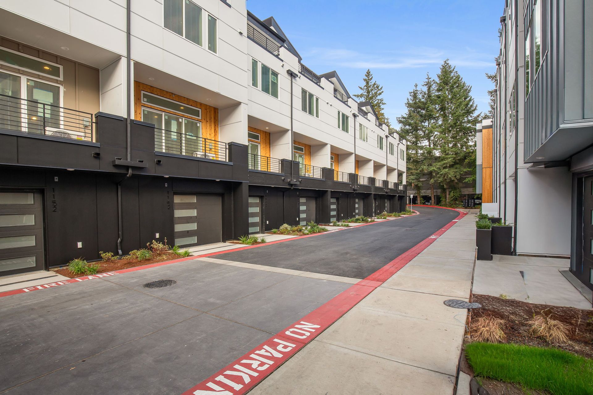 Back of building 1 showing the living room decks and garage entrances