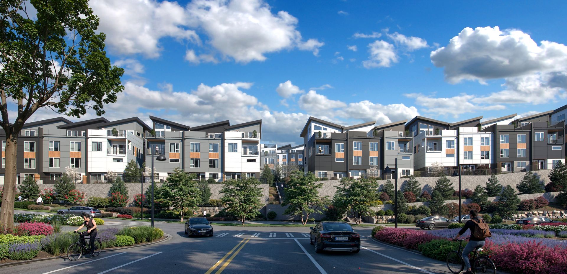 A view of Everra from the intersection of Shangri-La Way NW and NW Talus Drive, showcasing the community’s cohesive architecture and connection to its Talus setting.