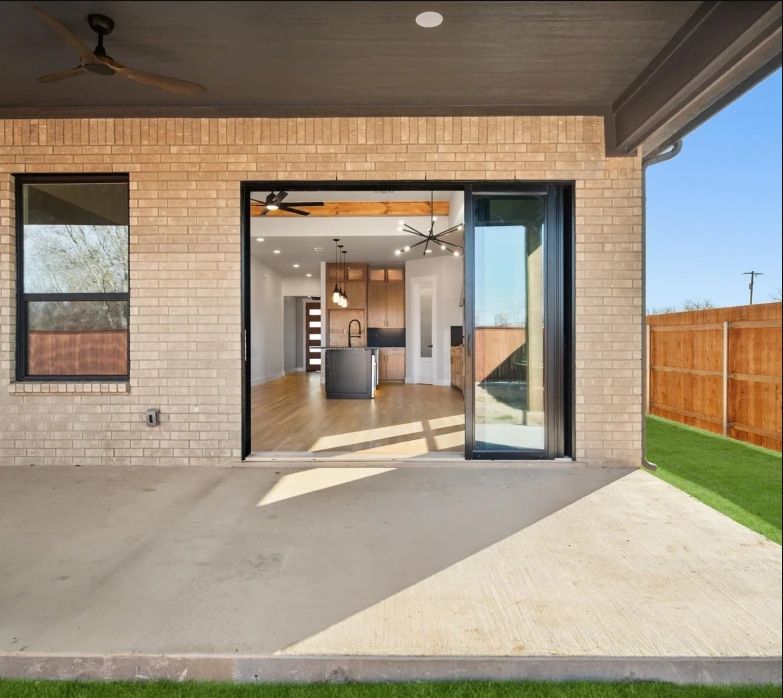 Extended patio with cedar posts and a ceiling fan, 9' patio sliding door