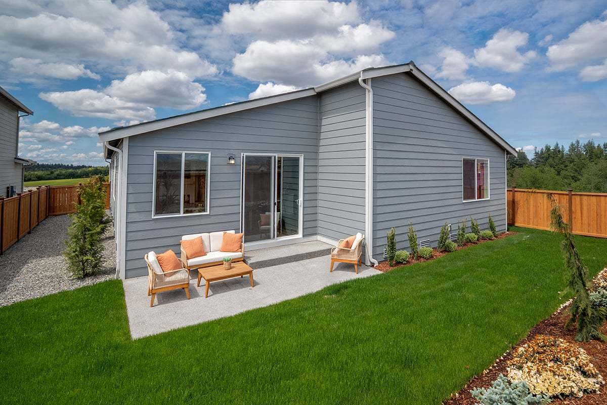 Landscaped and fenced back yard with patio