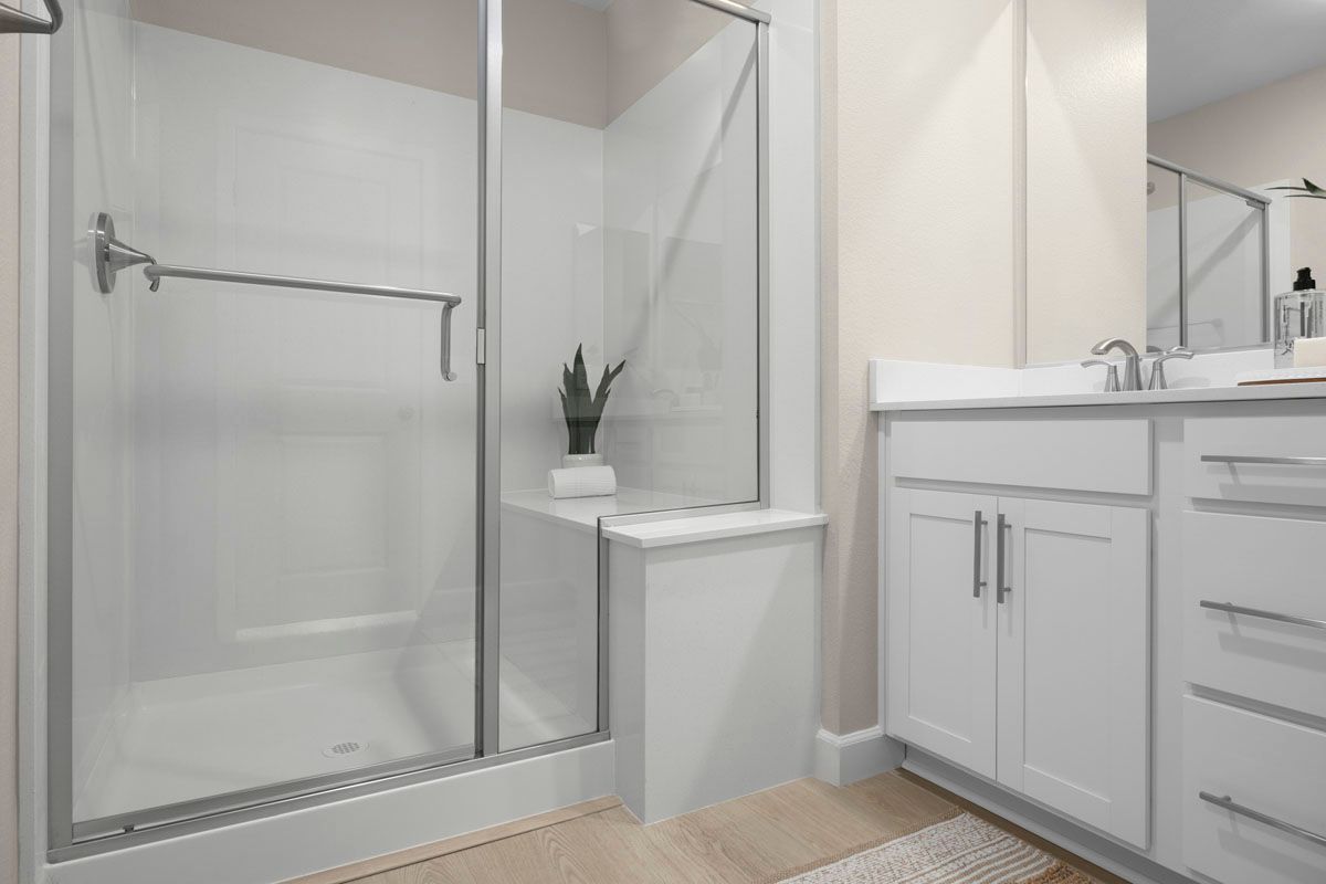 Plan 1803 Interior Unit Modeled - Enlarged walk-in shower with seat at primary bath