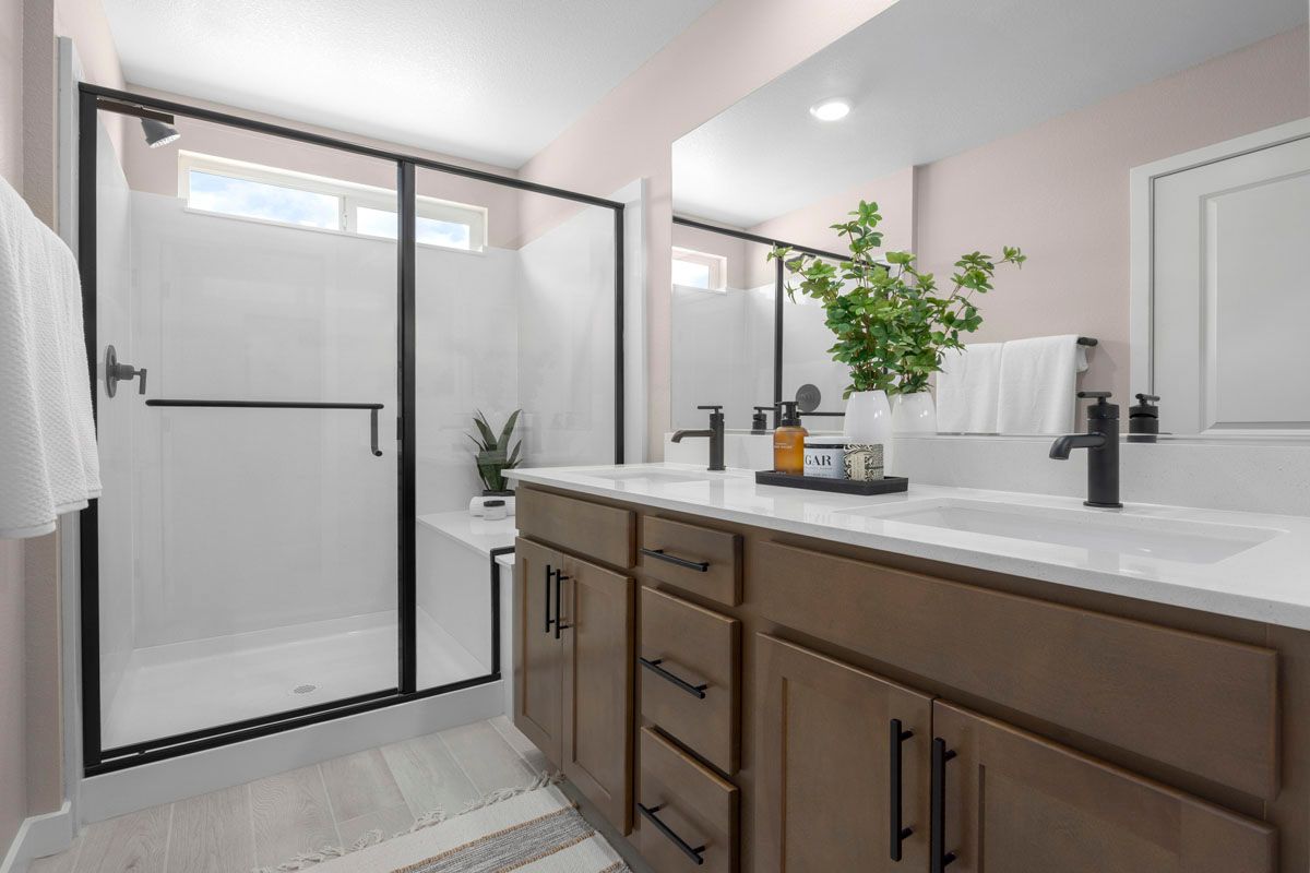 Plan 1895 End Unit Modeled - Enlarged walk-in shower with seat at primary bath
