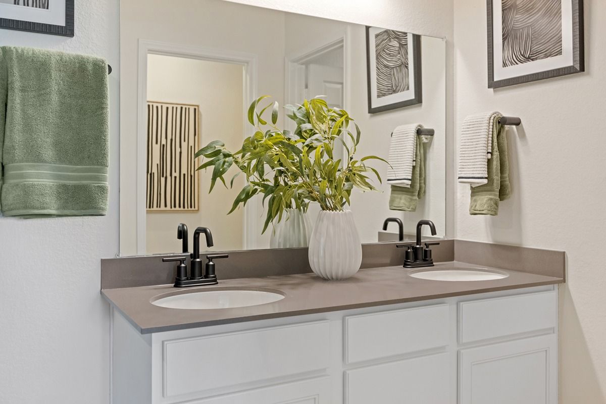 Plan 1676 Modeled - Dual-sink vanity at bath 2
