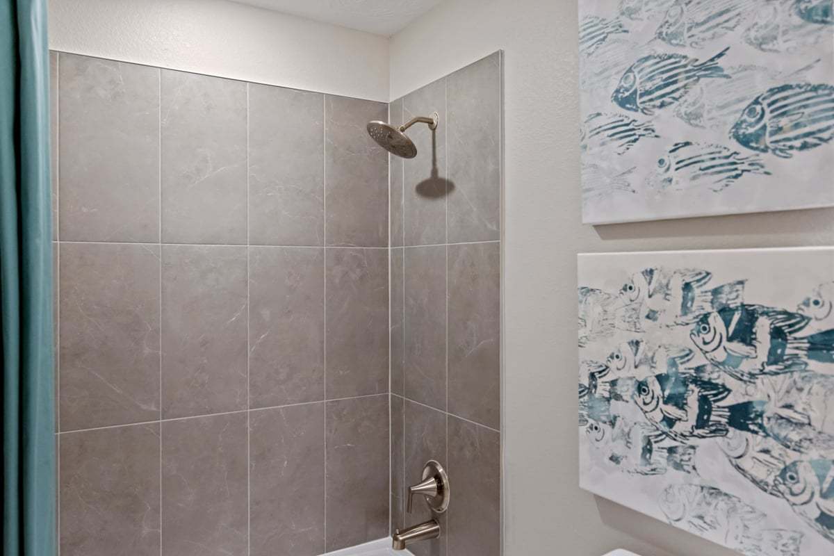 Tub/shower combination with tile surround at bath 2