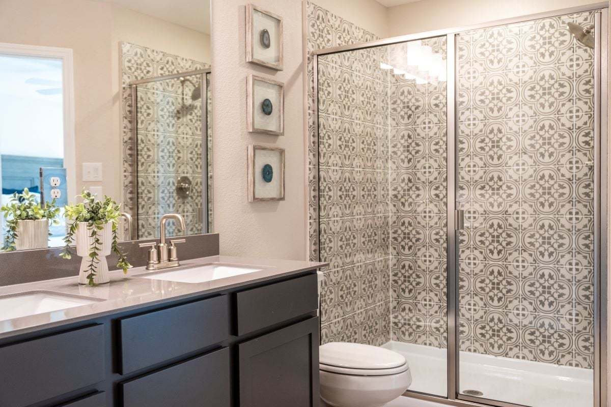 Optional walk-in shower with tile surround at primary bath