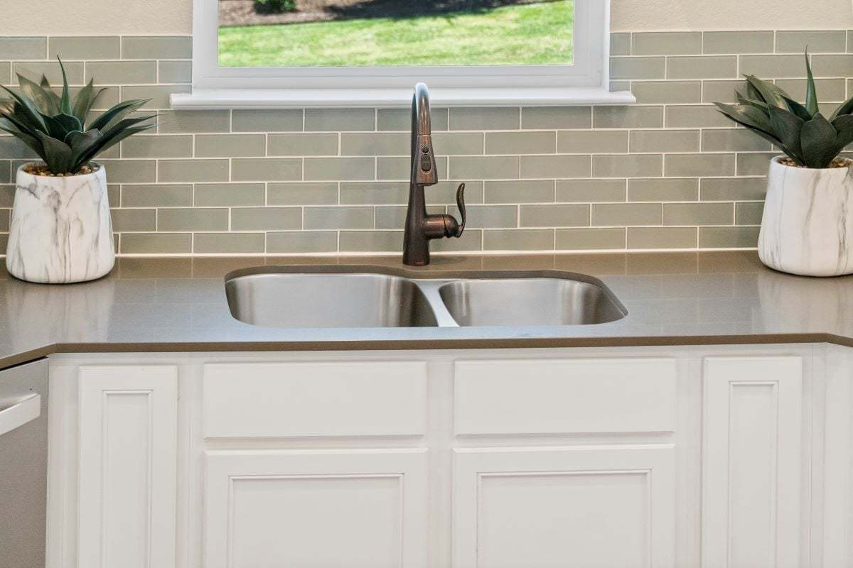 Dual-basin kitchen sink