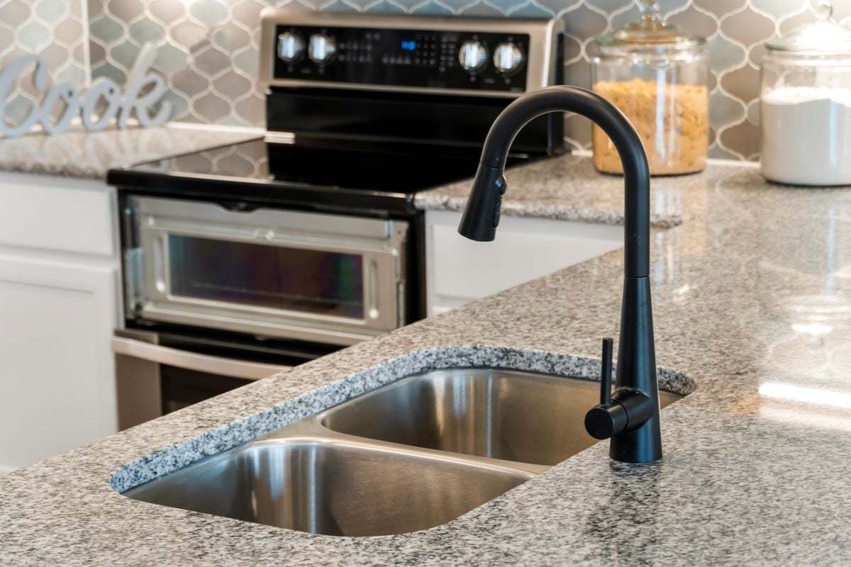 Dual-basin kitchen sink