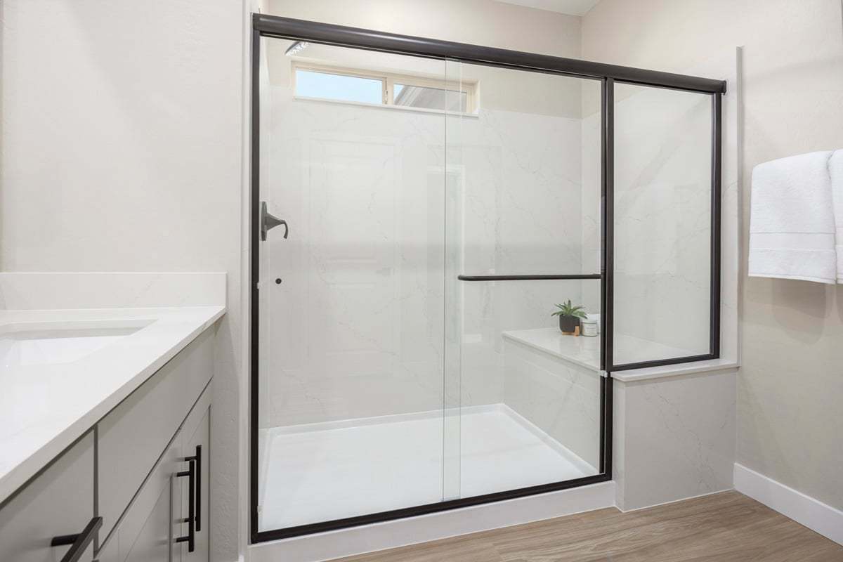 Plan 2466 Modeled - Enlarged walk-in shower with seat at primary bath