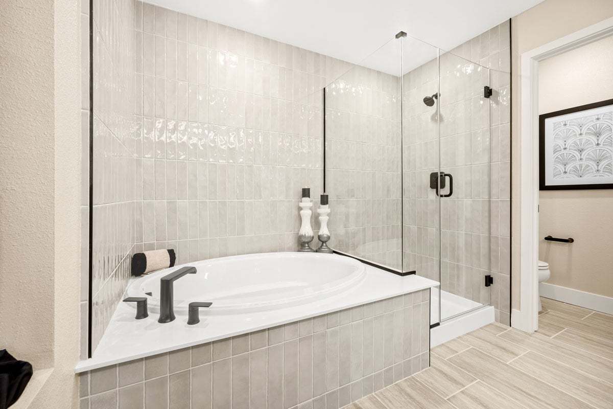 Plan 2236 Modeled - Tub and separate shower with custom tile surround at primary bath