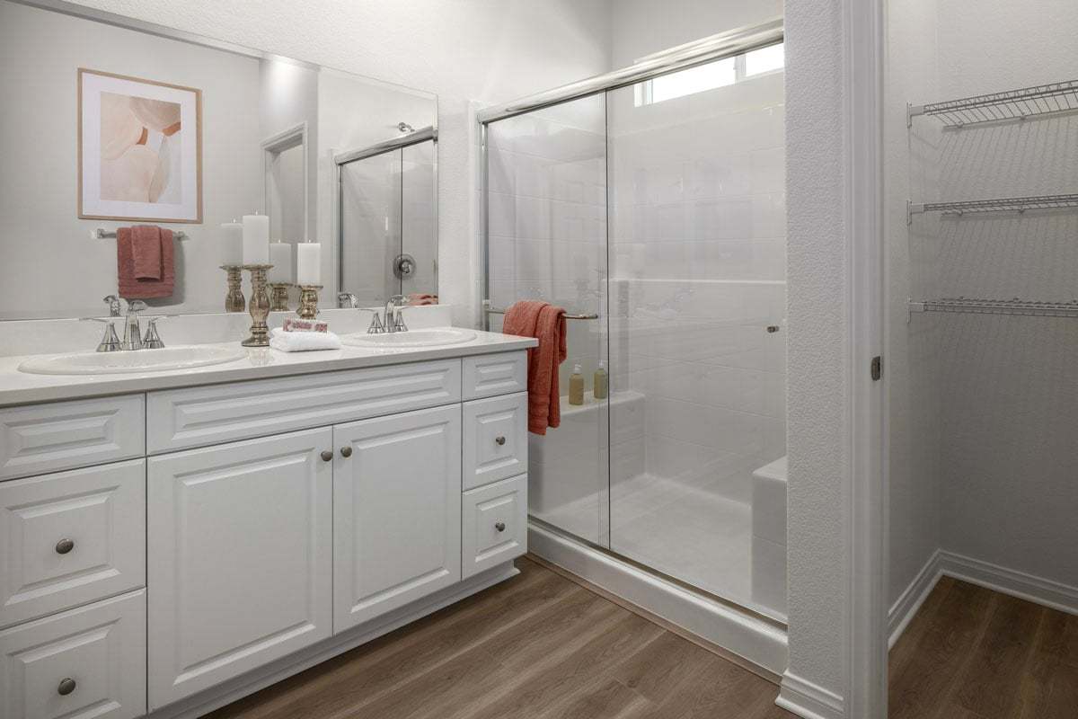 Plan 1663 Modeled - Walk-in shower with clear glass enclosure at primary bath