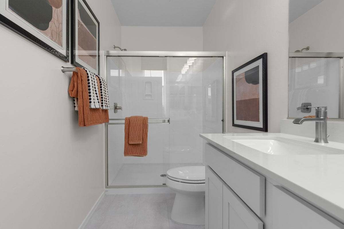 Plan 1465 Modeled - Upgraded shower with cultured marble surround at primary bath
