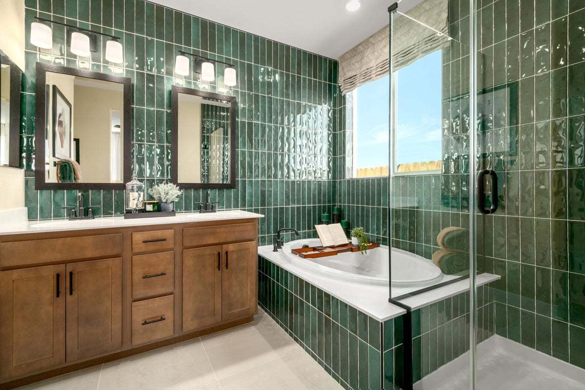 Plan 1685 Modeled - Tub and separate shower with a custom tile surround at primary bath