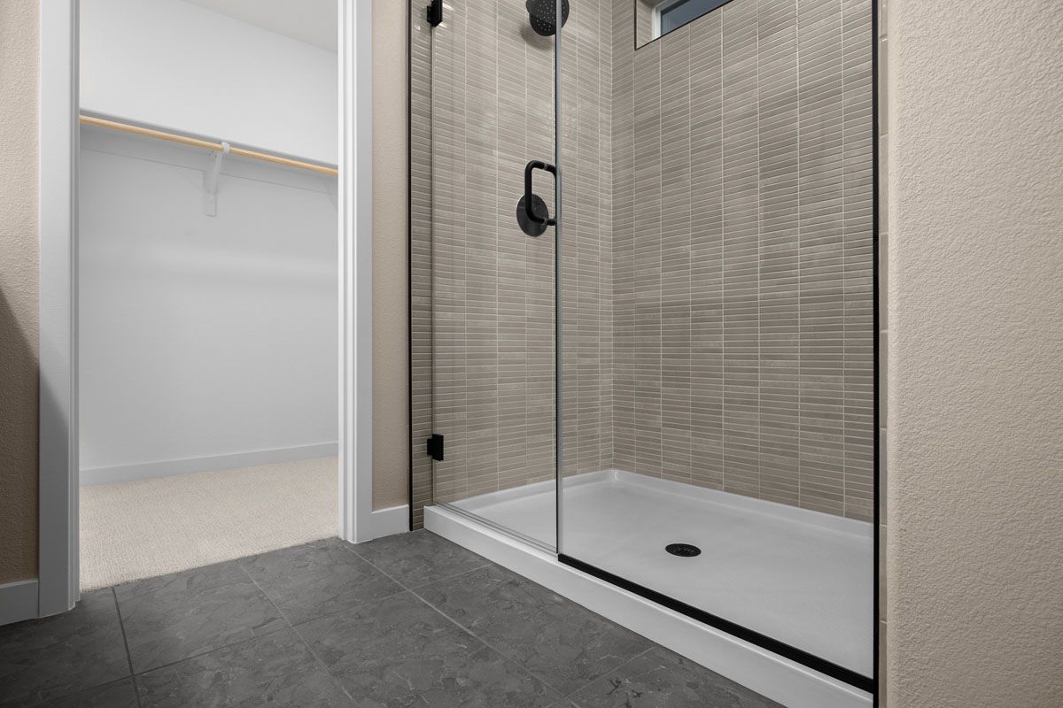 Plan 1708 Modeled - Walk-in shower with tile surround at primary bath