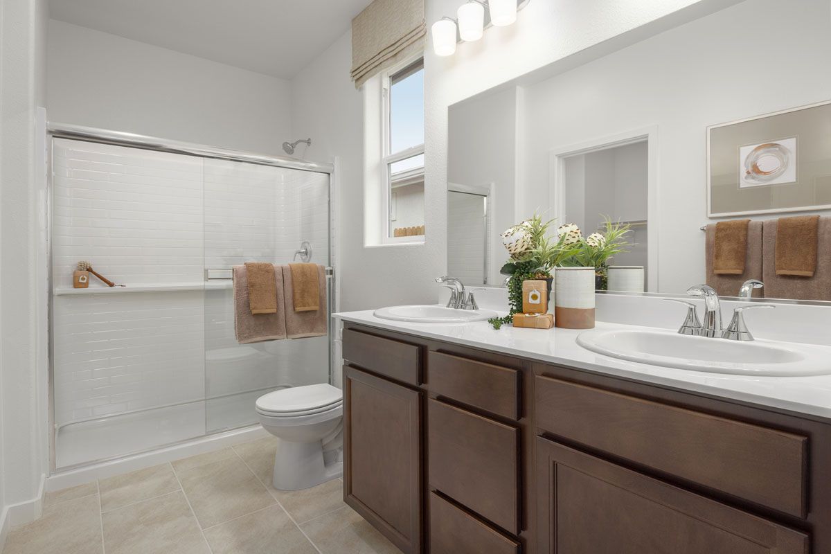 Plan 1429 Modeled - Solid-surface countertops at primary bath