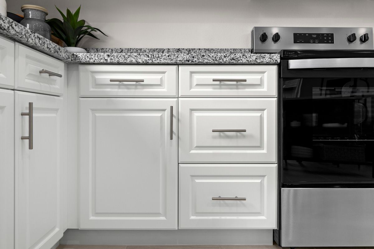 Plan 1616 Modeled - Thermofoil cabinets with satin nickel pulls