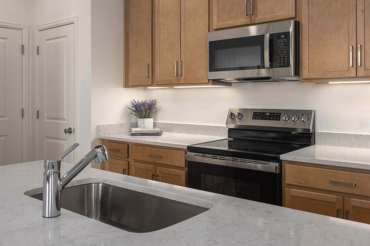 Plan 1672 Modeled - Quartz countertops at kitchen island
