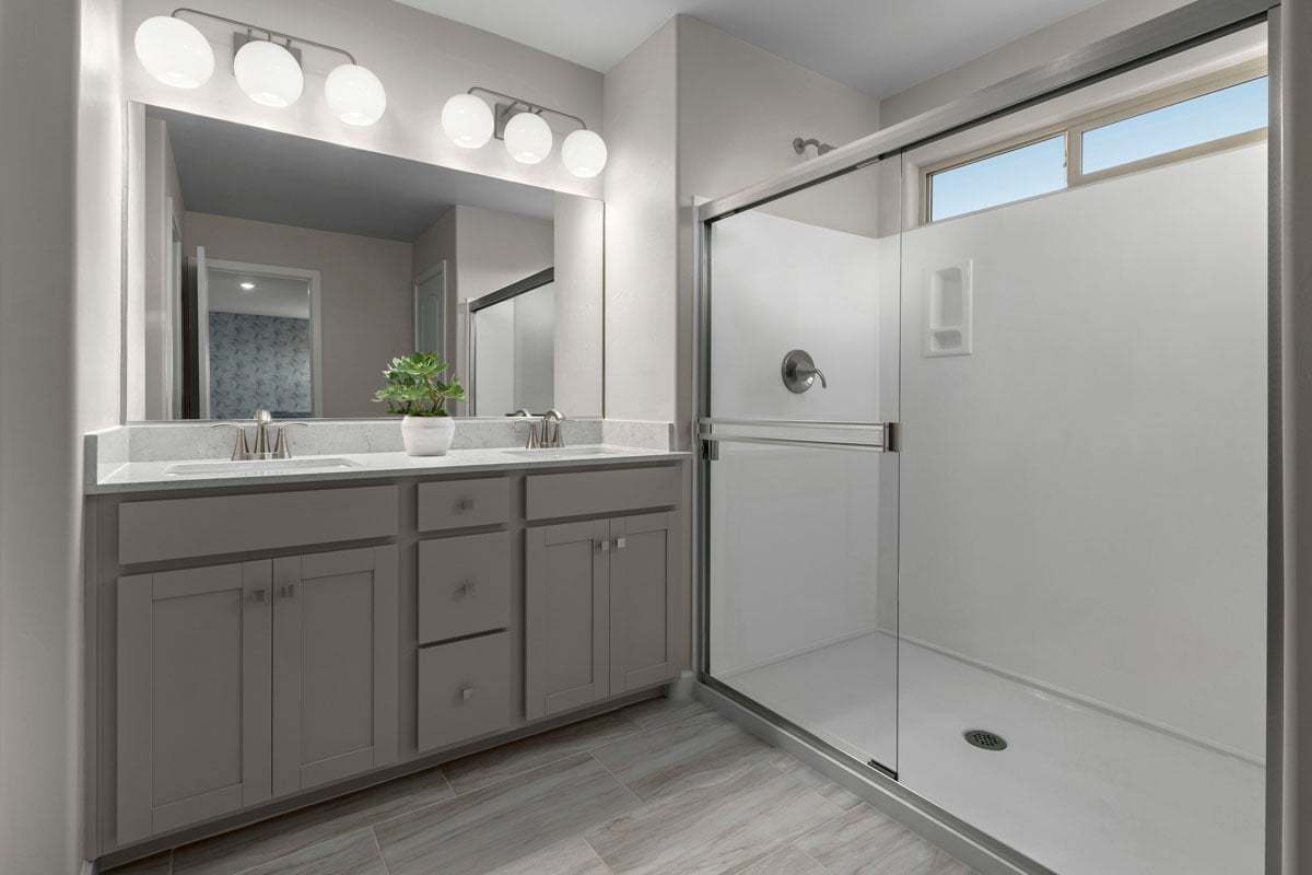 Plan 2212 Modeled - Upgraded walk-in shower with cultured marble surround at primary bath