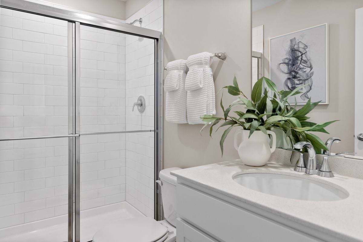 Plan 1359 Modeled - Walk-in shower with tile surround at primary bath