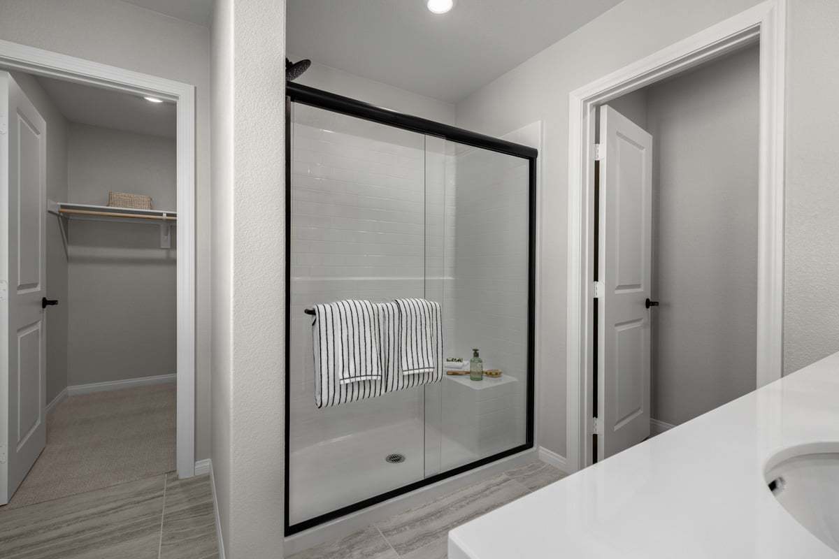 Plan 1760 Modeled - Optional matte black shower enclosure at primary bath