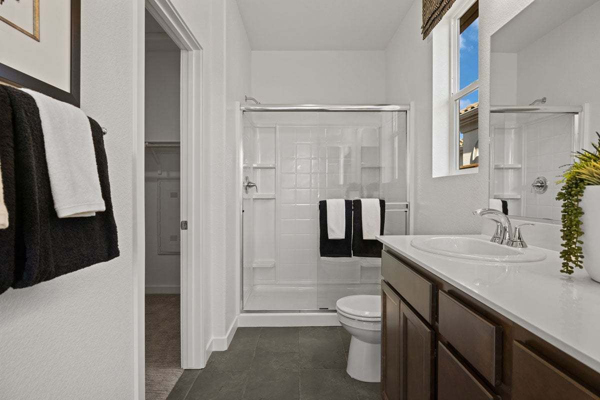 Plan 1429 Modeled - Walk-in shower with chrome frame enclosure