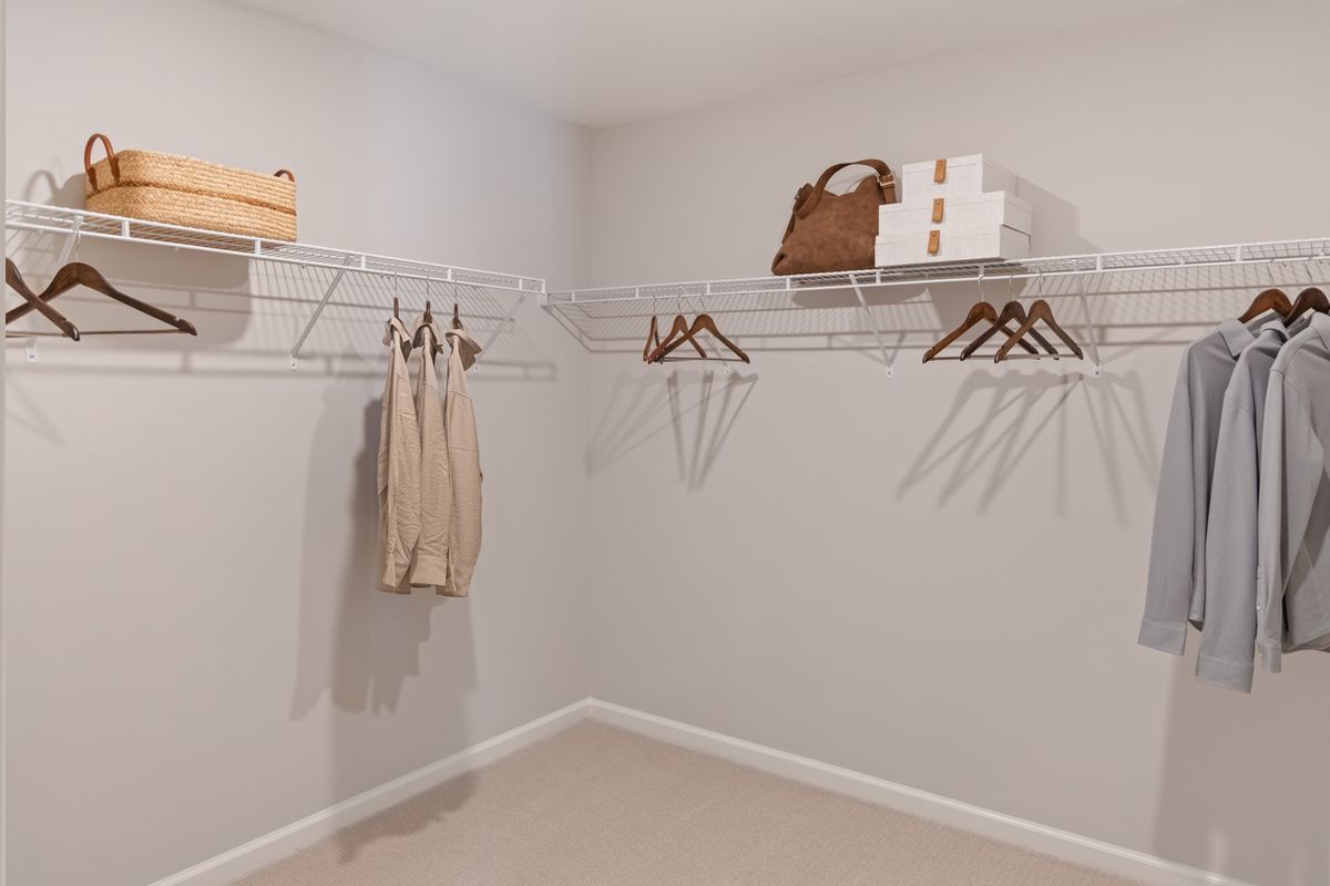 Plan 1910 Modeled - Spacious walk-in closet at primary suite