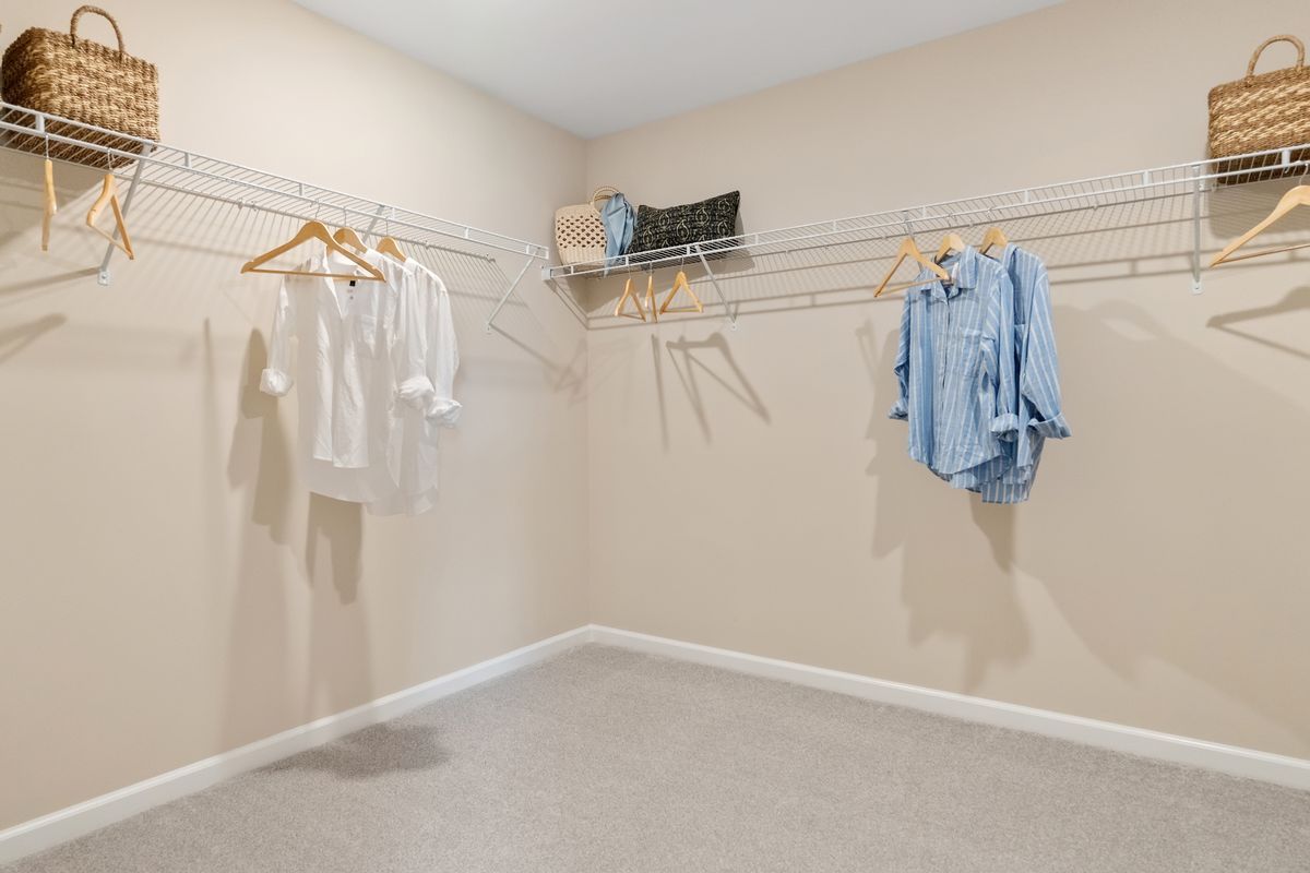 Plan 1910 Modeled - Spacious walk-in closet at primary suite