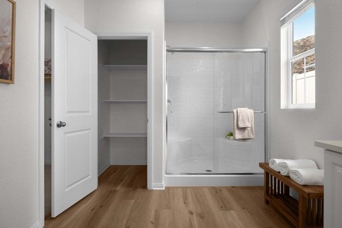 Plan 2097 Modeled - Walk-in shower and linen closet at primary bath