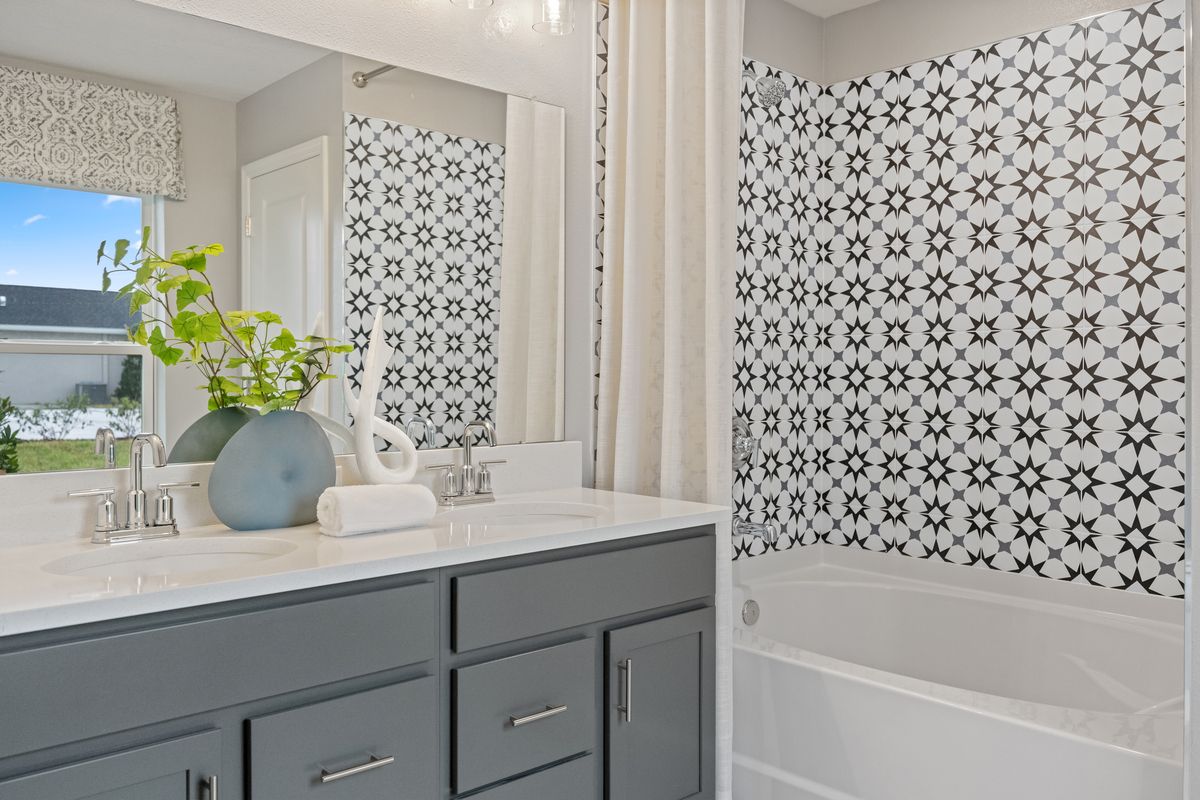 Plan 1989 Modeled - Garden tub with tile surround at primary bath