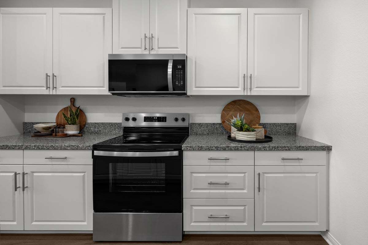 Plan 2121 Modeled - White thermofoil cabinets with satin nickel pulls