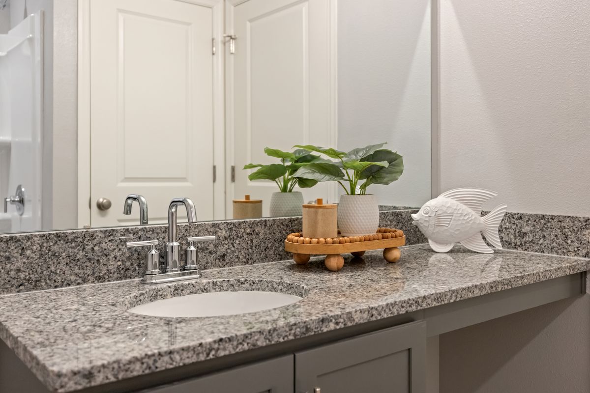 Plan 1989 Modeled - Granite countertops at bath 2