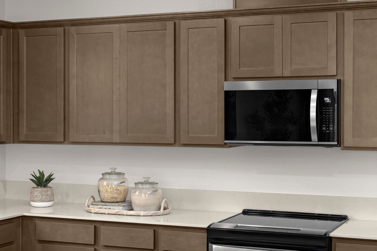Plan 1865 Modeled - Recessed-panel stained birch cabinets