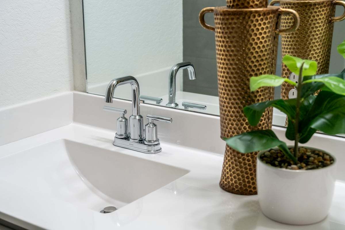 Plan 2154 - Cultured marble vanity with integrated sink at primary bath