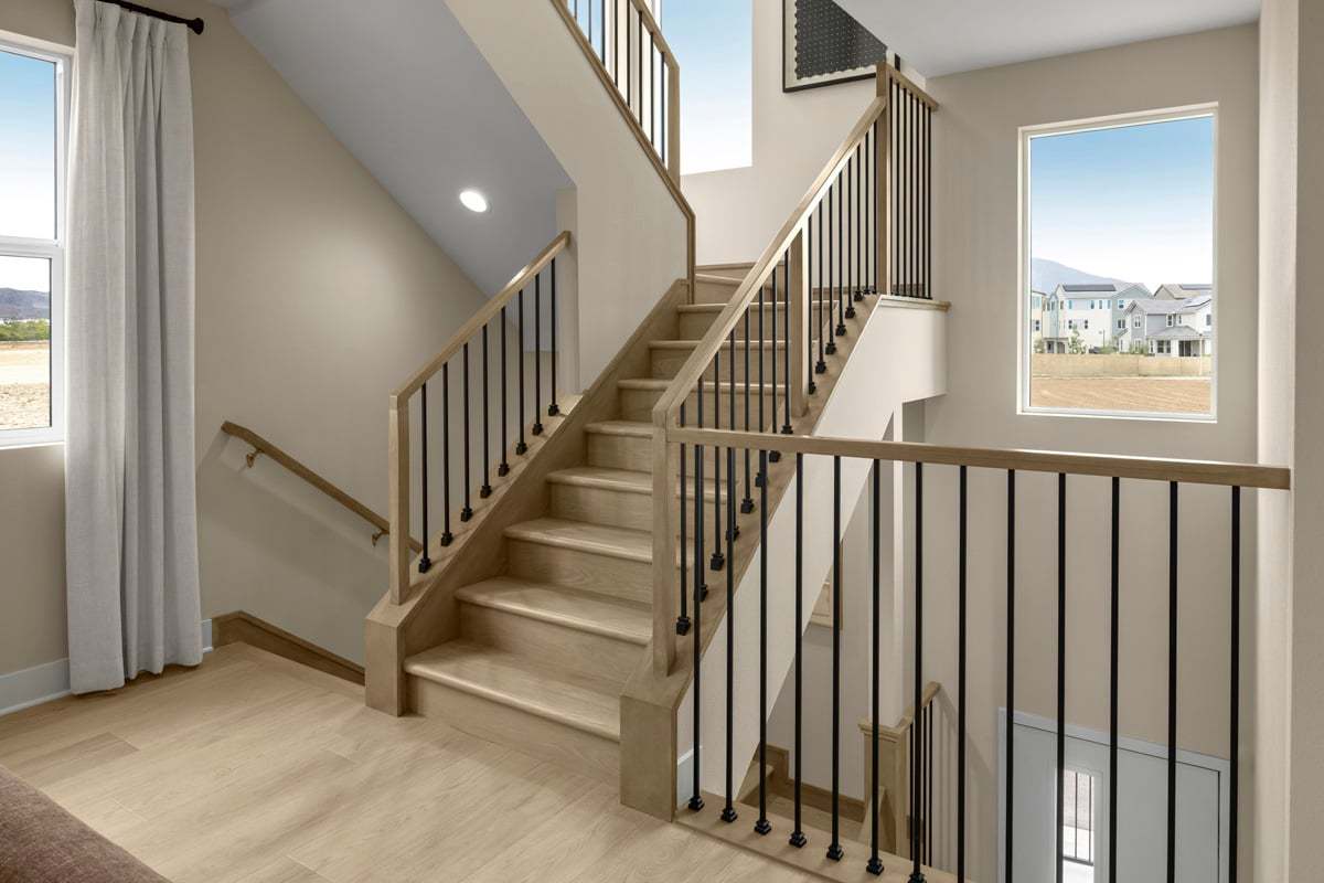 Plan 2661 Modeled - Optional stair rail system with oak-stained wood posts and iron balusters
