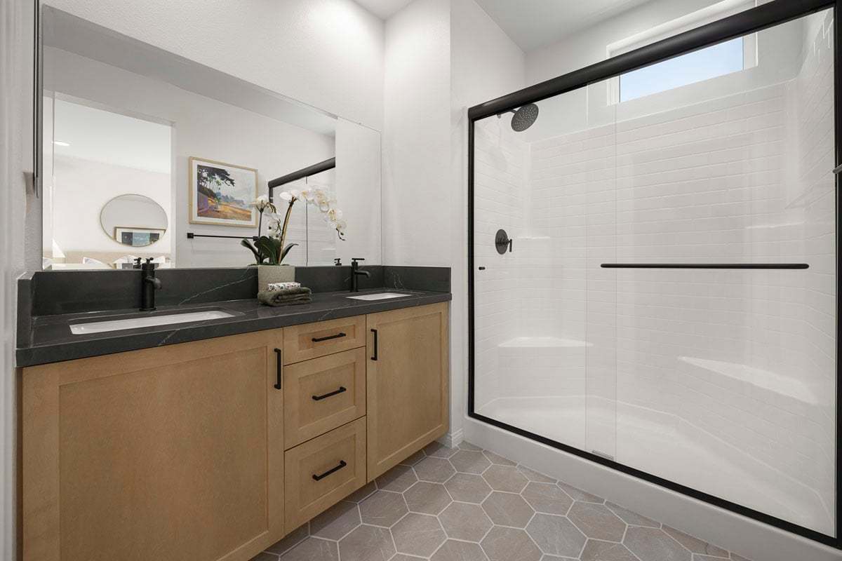 Plan 1630 Modeled - Full shower with optional matte black frame at primary bath