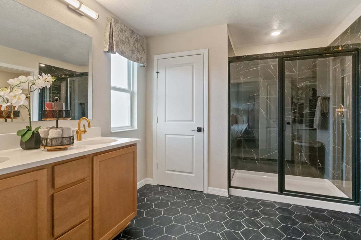 Plan 2107 Modeled - Walk-in shower with tile surround at primary bath