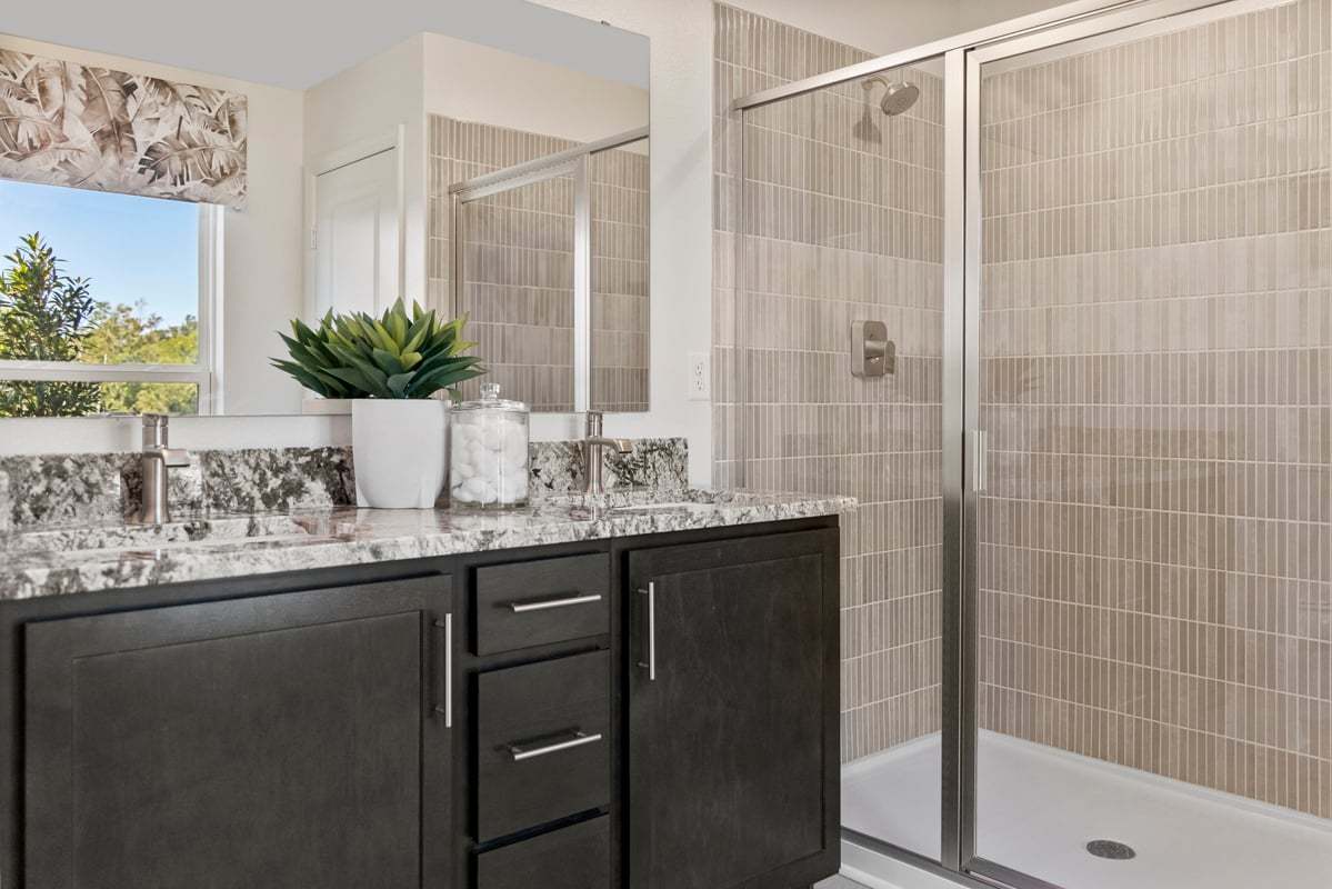 Plan 1989 Modeled - Walk-in shower with tile surround at primary bath