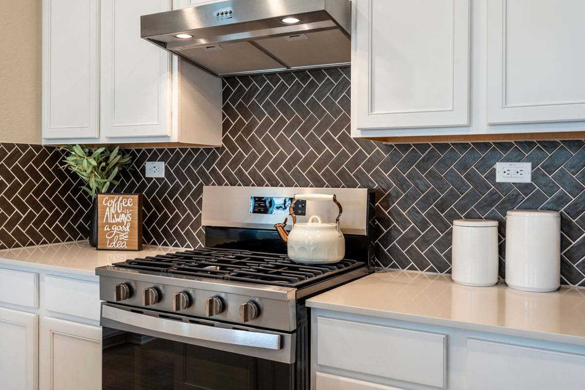 Plan 1605 Modeled - Glossy tile backsplash in herringbone pattern